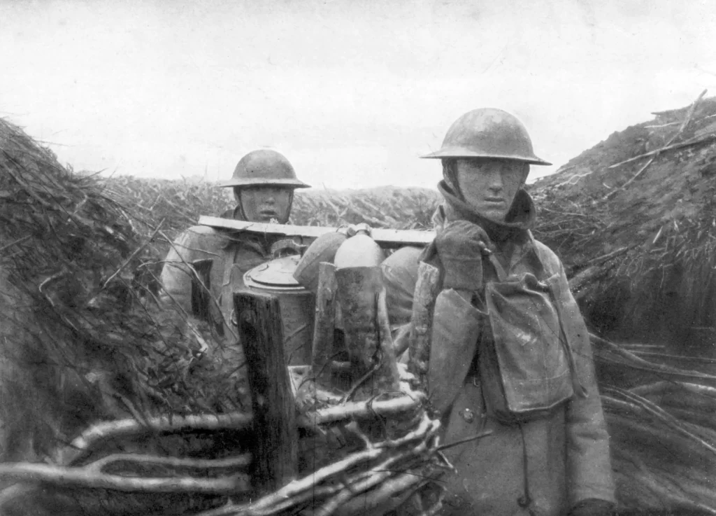 American troops at the World War I front deliver soup to their comrades, 1917-1918. World War I veteran Edward Bullard was inspired by doughboy steel helmets to invent the first construction hard hat in 1919.