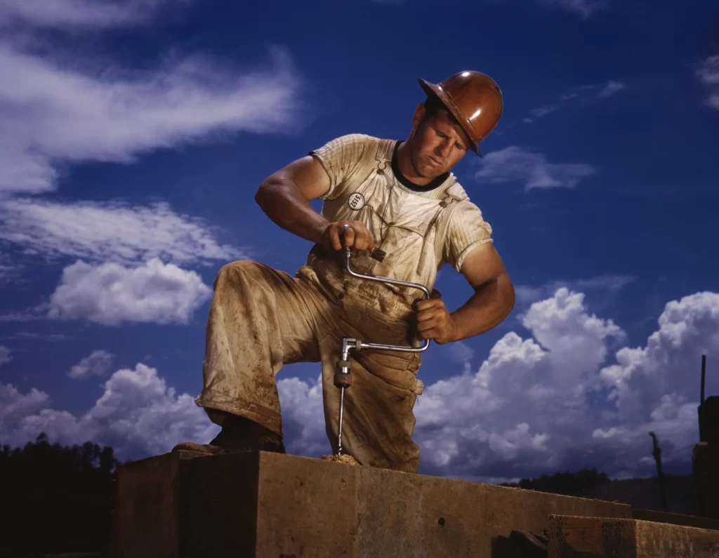 Carpenter working on TVA's Douglas Dam, French Broad River, in Sevier County, Tenn.; Alfred T. Palmer for Office of War Information, June 1942.