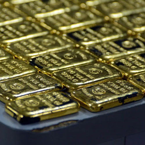 Gold holds steady as safe-haven demand counters stronger dollar